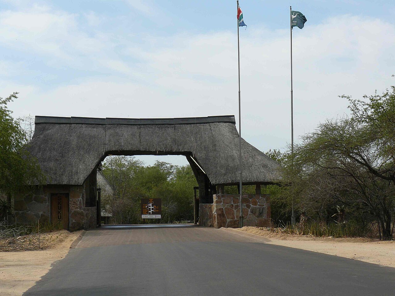 Entrance gate with thatched roof to Skukuza Rest Camp in Kruger National Park